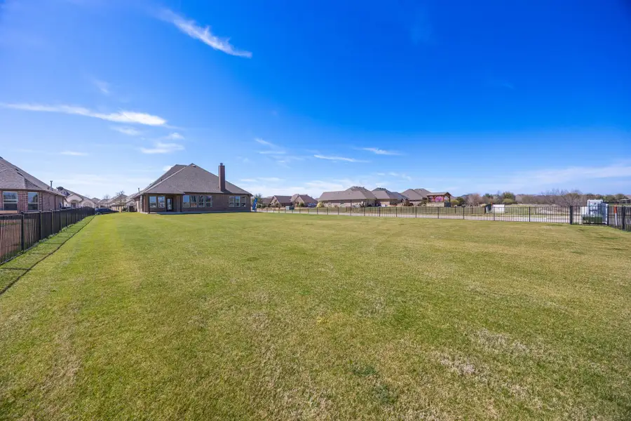 Exterior details and patio area of a home in Abe's Landing, Granbury (Image 4).
