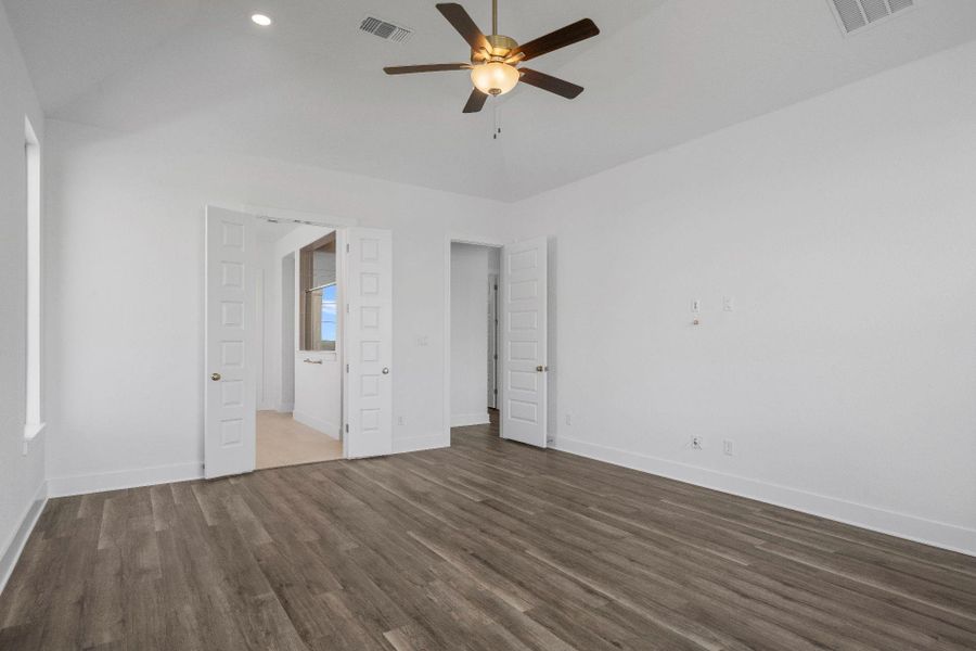 Primary Bedroom with elevated ceiling Primary Bedroom with elevated ceiling
