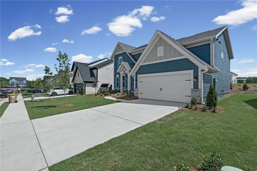 Front exterior of a new home in Twin Lakes, Hoschton, GA, highlighting curb appeal (Image 19).