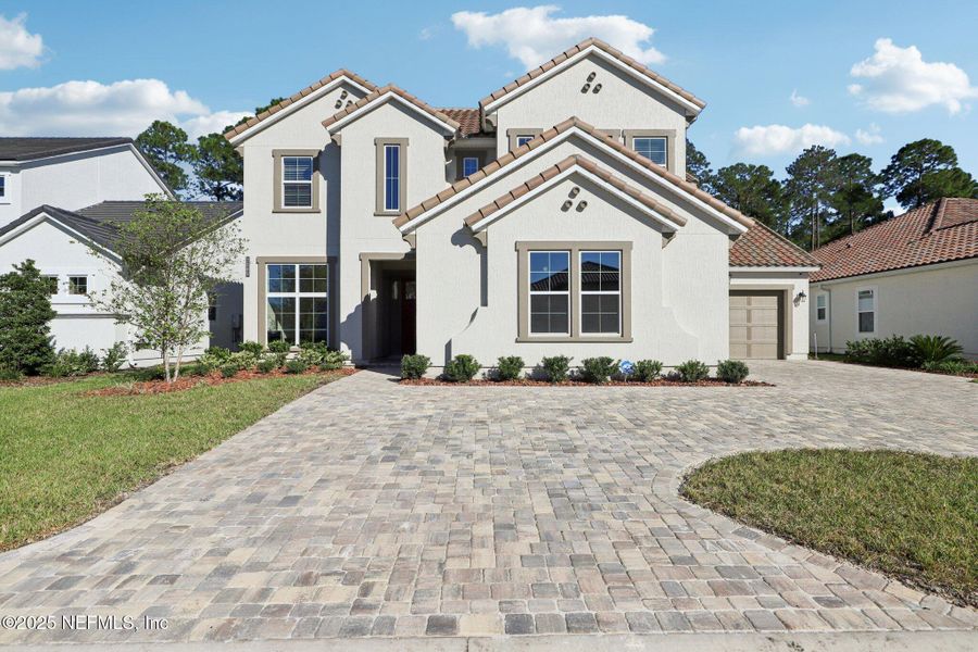 Front exterior of a new home in Tamaya, Jacksonville, FL, highlighting curb appeal (Image 1). Front exterior of a new home in Tamaya, Jacksonville, FL, highlighting curb appeal (Image 1).