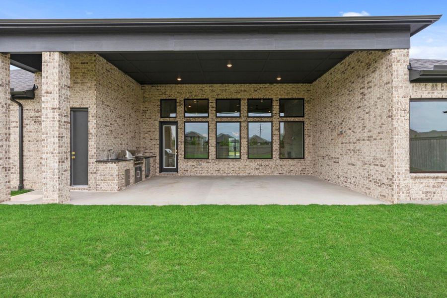 Back door leading out to your covered patio and outdoor kitchen. Representative image.