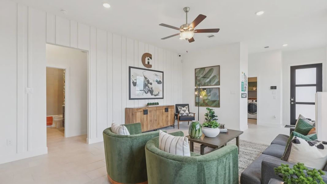 Representative furnished interior of a home built from the Adele by Chesmar Homes in Sunterra, Katy (Image 7).