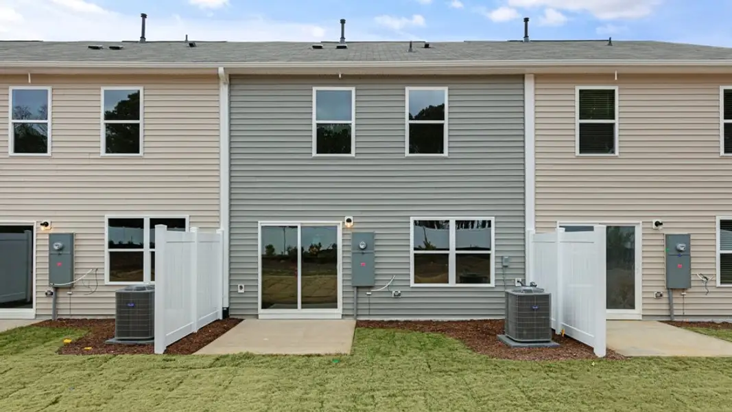 Exterior details and patio area of a home in The Townes at Honeycutt Oaks, Angier (Image 2). Exterior details and patio area of a home in The Townes at Honeycutt Oaks, Angier (Image 2).