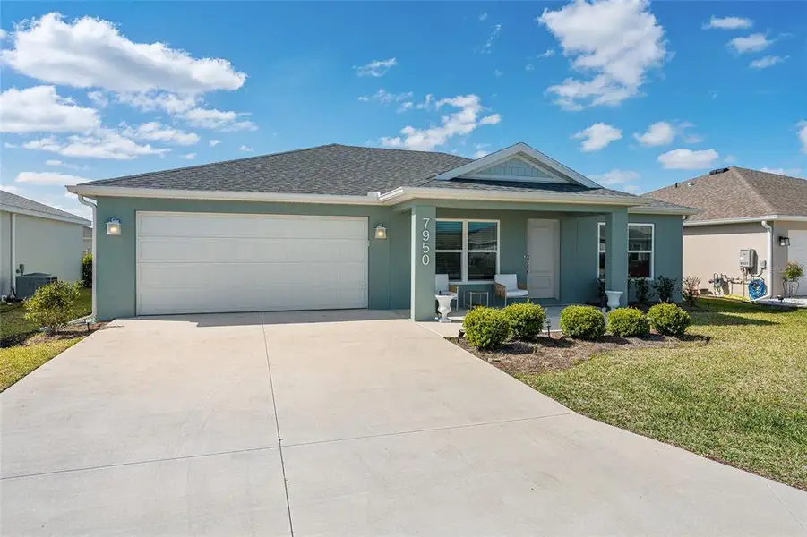 Front exterior of a new home in , The Villages, FL, highlighting curb appeal (Image 26).
