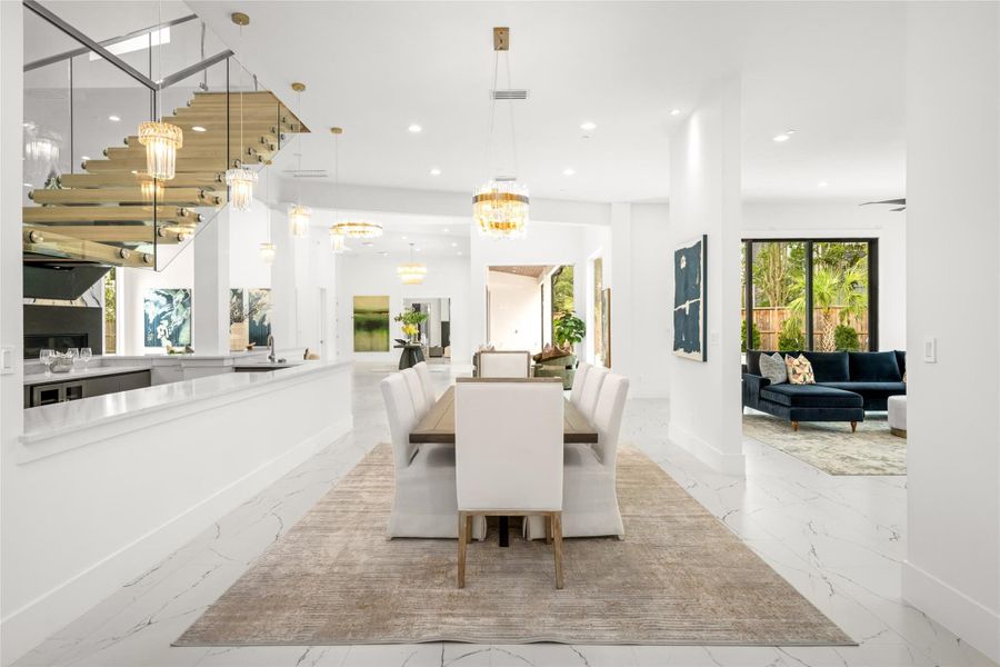Thoughtfully positioned adjacent to the entertaining wet bar, it offers seamless flow for hosting an incredible gathering. Thoughtfully positioned adjacent to the entertaining wet bar, it offers seamless flow for hosting an incredible gathering.