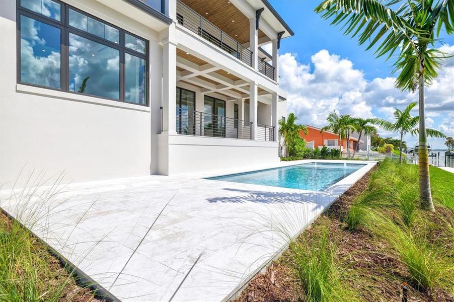 Front exterior of a new home in , Longboat Key, FL, highlighting curb appeal (Image 24). Front exterior of a new home in , Longboat Key, FL, highlighting curb appeal (Image 24).
