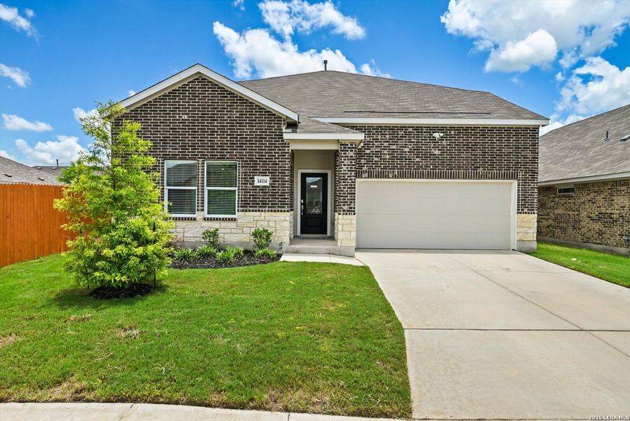 Front exterior of a new home in Brookmill: Classic Collection, San Antonio, TX, highlighting curb appeal (Image 1). Front exterior of a new home in Brookmill: Classic Collection, San Antonio, TX, highlighting curb appeal (Image 1).
