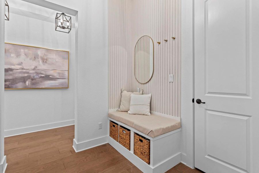 Mudroom with wood-type flooring