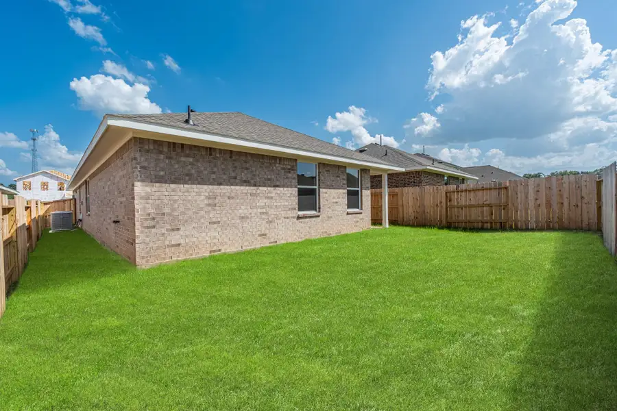 Front exterior of a new home in Stonebrooke, Conroe, TX, highlighting curb appeal (Image 15). Front exterior of a new home in Stonebrooke, Conroe, TX, highlighting curb appeal (Image 15).