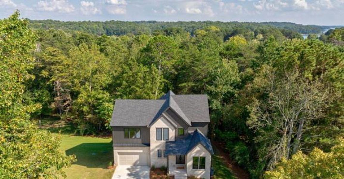 Front exterior of a new home in , Cumming, GA, highlighting curb appeal (Image 1). Front exterior of a new home in , Cumming, GA, highlighting curb appeal (Image 1).