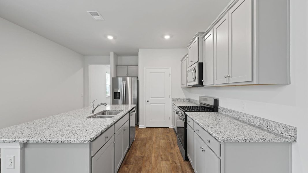 Furnished interior view inside a new home in Pine Hills at Cane Bay, Summerville (Image 5). Furnished interior view inside a new home in Pine Hills at Cane Bay, Summerville (Image 5).