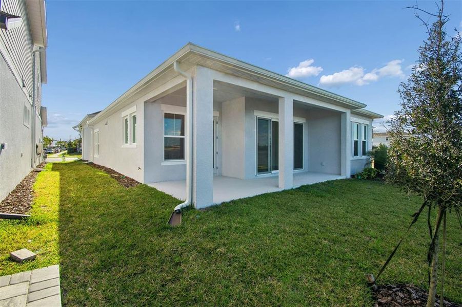 Exterior details and patio area of a home in Emerald Landing at Waterside at Lakewood Ranch – Lake Series, Sarasota (Image 3).