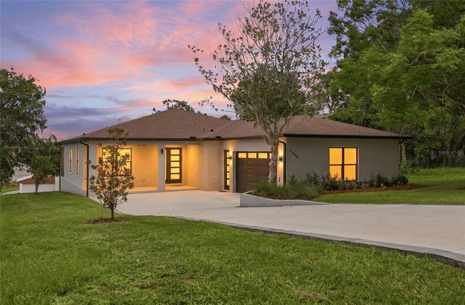 Front exterior of a new home in , Montverde, FL, highlighting curb appeal (Image 1). Front exterior of a new home in , Montverde, FL, highlighting curb appeal (Image 1).