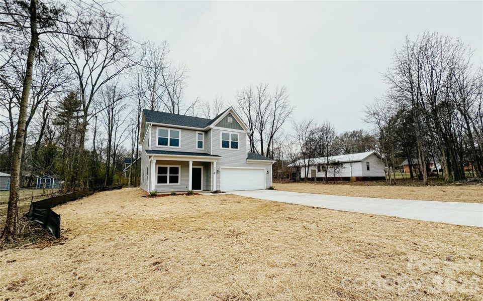 Front exterior of a new home in , Harrisburg, NC, highlighting curb appeal (Image 19).