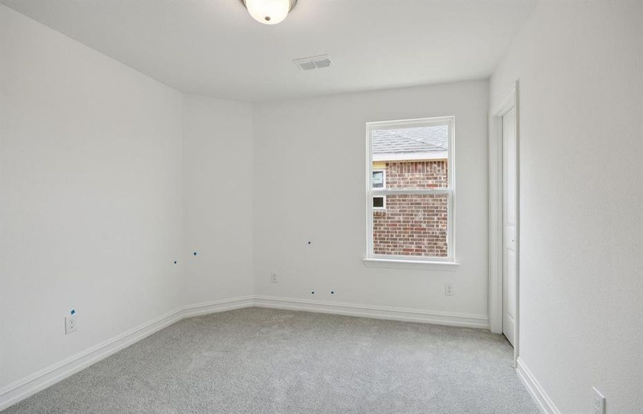 Roomy secondary bedroom with extensive closet storage *Real home pictured Roomy secondary bedroom with extensive closet storage *Real home pictured