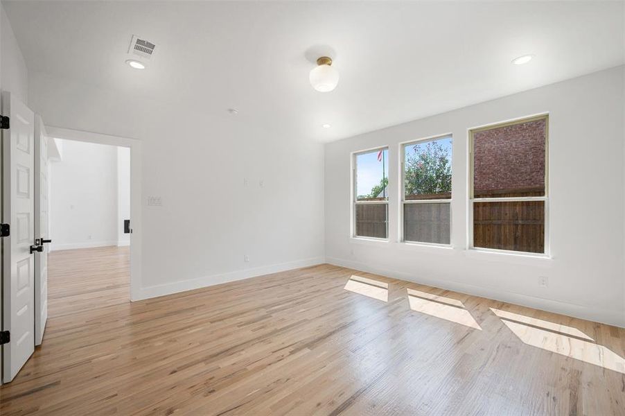 Unfurnished room with light wood-type flooring and recessed lighting