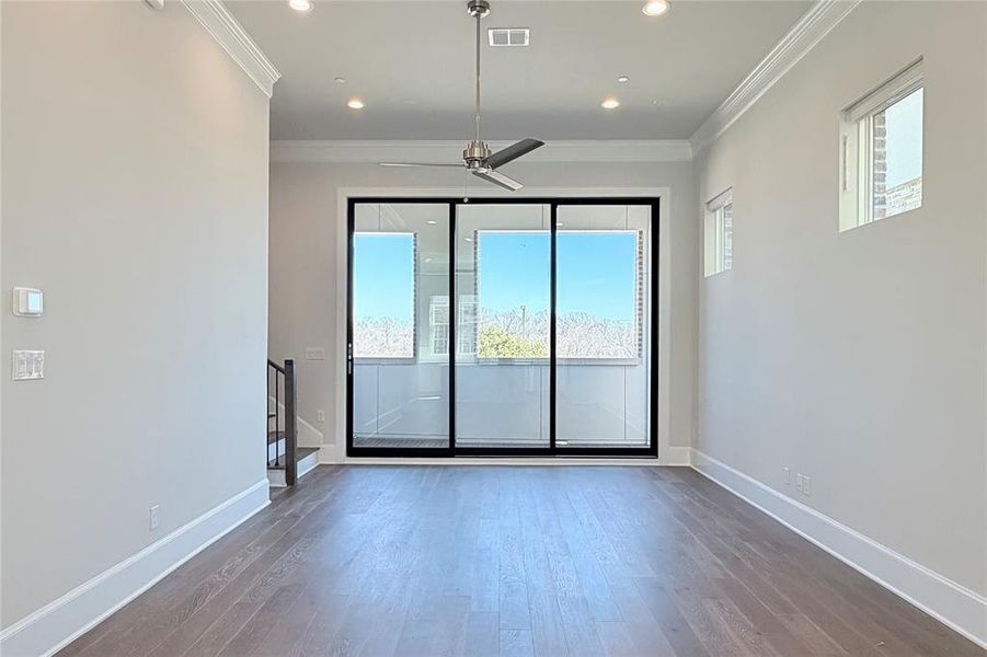 Progress photo of actual unit. 12' ceilings, 10' sliding glass patio doors leading to private balcony.