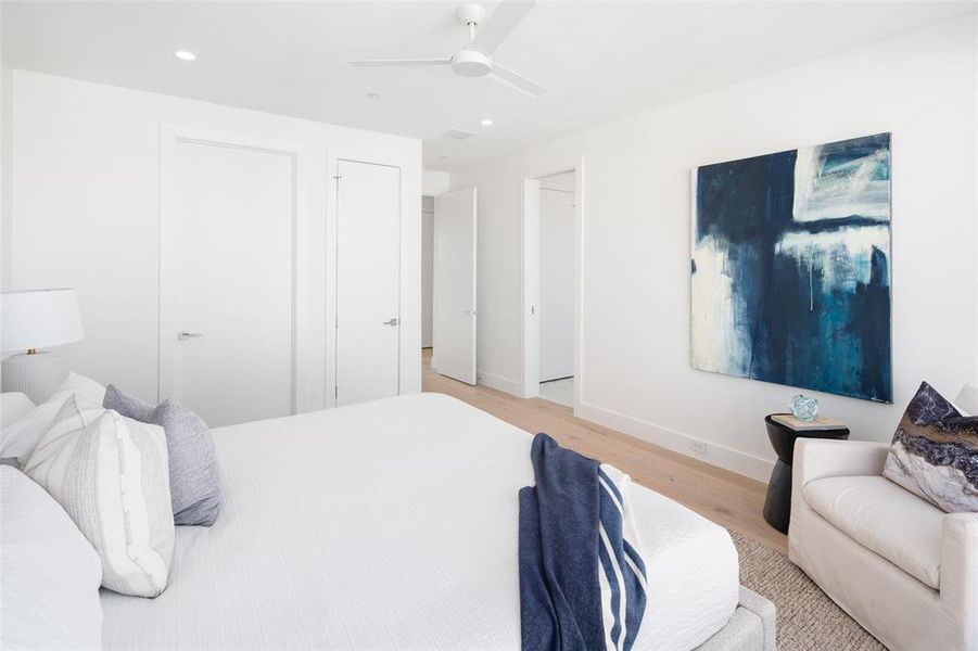 Bedroom with ceiling fan and light hardwood / wood-style floors