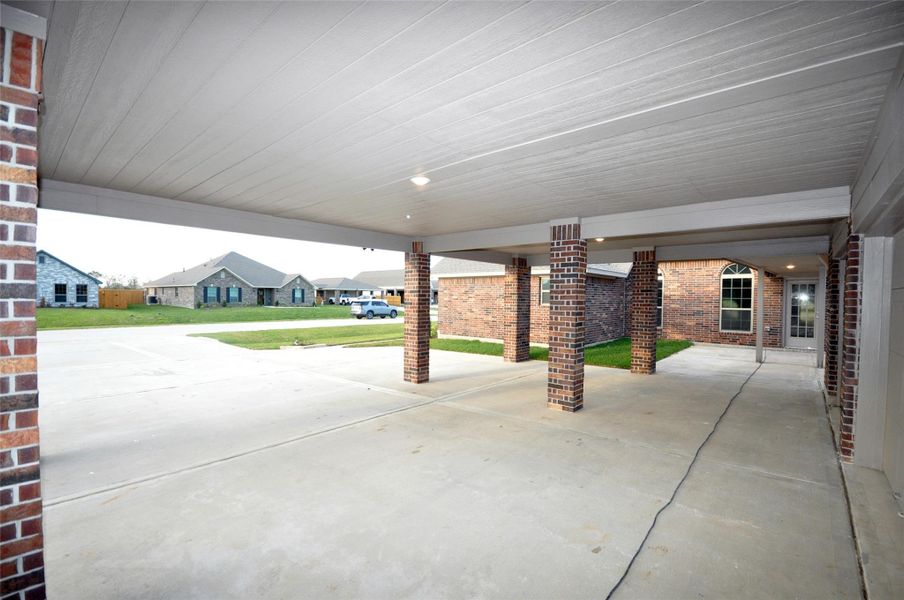 Parking under cover for 3 vehicles under the porte chochere Parking under cover for 3 vehicles under the porte chochere