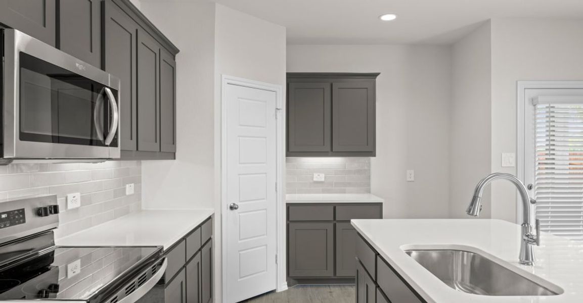 Representative exterior photo of a completed home built from the Willow by Impression Homes in Keeneland, Aubrey, TX (Image 7). Representative exterior photo of a completed home built from the Willow by Impression Homes in Keeneland, Aubrey, TX (Image 7).