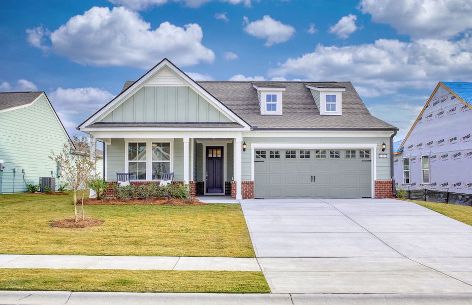 Front exterior of a new home in Crescent Cove, Myrtle Beach, SC, highlighting curb appeal (Image 1).