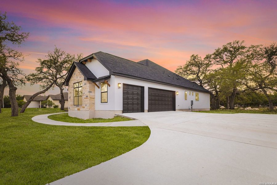 Front exterior of a new home in , Spring Branch, TX, highlighting curb appeal (Image 2). Front exterior of a new home in , Spring Branch, TX, highlighting curb appeal (Image 2).