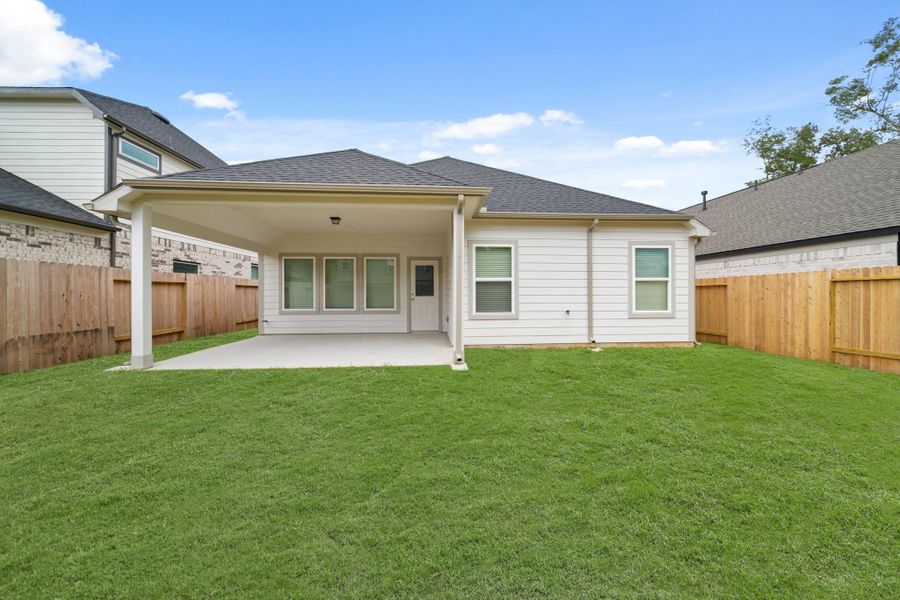 Front exterior of a new home in Barton Creek Ranch, Conroe, TX, highlighting curb appeal (Image 2). Front exterior of a new home in Barton Creek Ranch, Conroe, TX, highlighting curb appeal (Image 2).