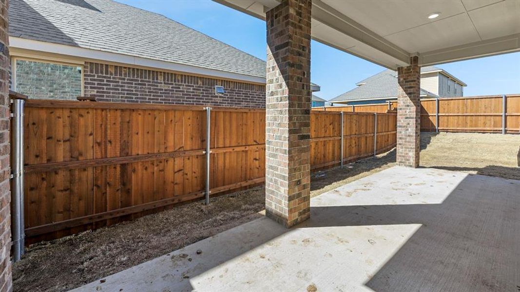 Fenced backyard with a patio Fenced backyard with a patio