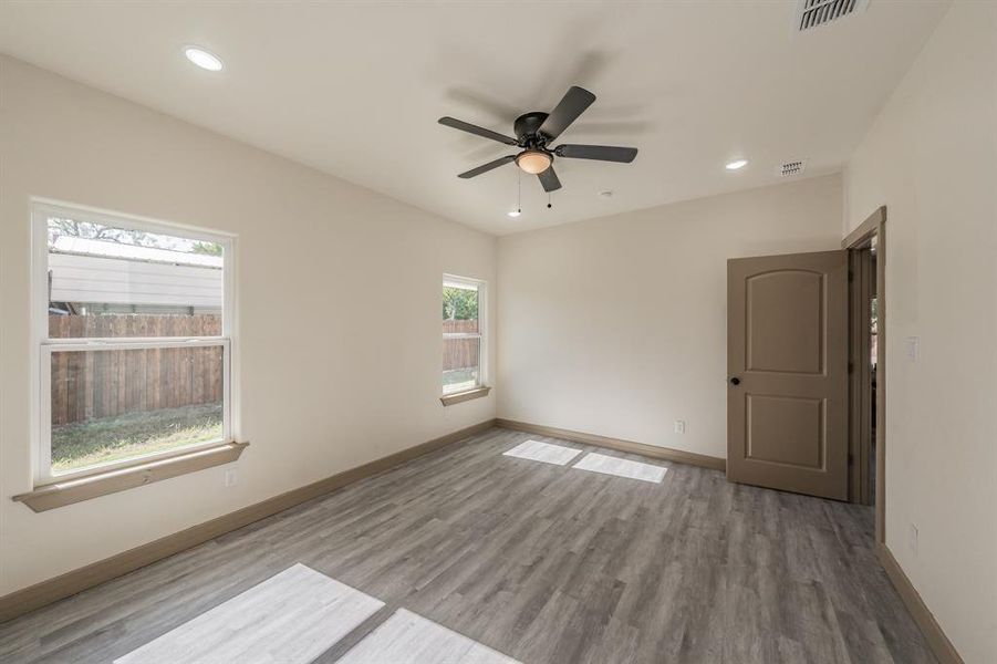 Unfurnished room featuring recessed lighting, light wood finished floors, and ceiling fan