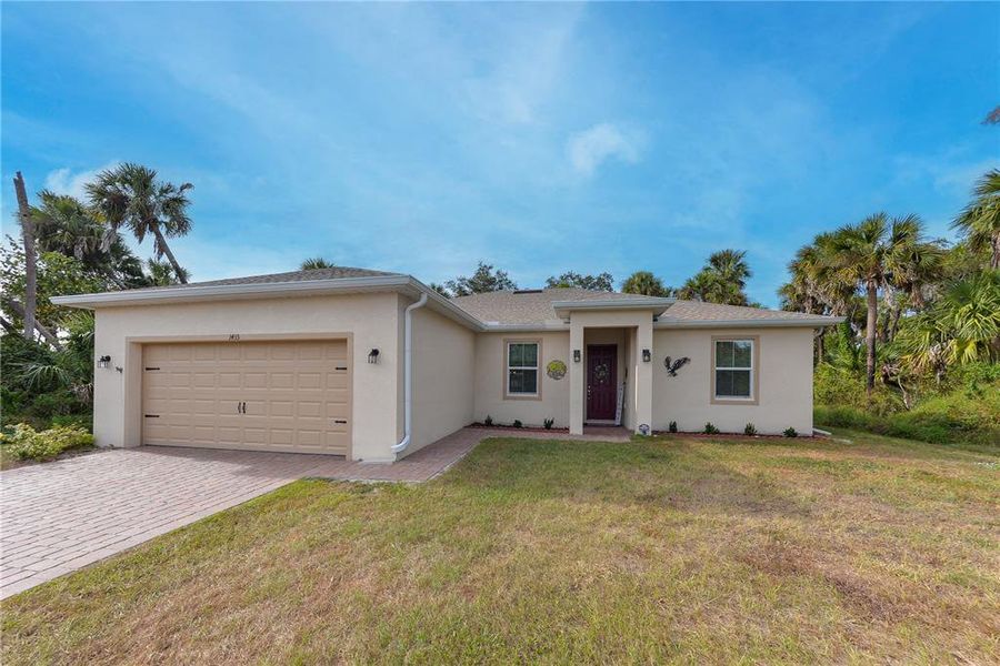 Front exterior of a new home in , North Port, FL, highlighting curb appeal (Image 21).