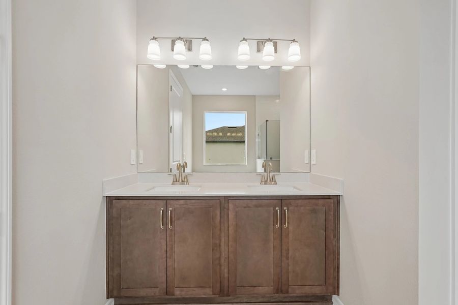 Primary bathroom has two sinks and features aspects of our AW Collection® Roosevelt
