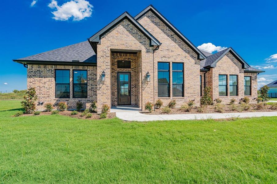 Craftsman-style home with a front yard