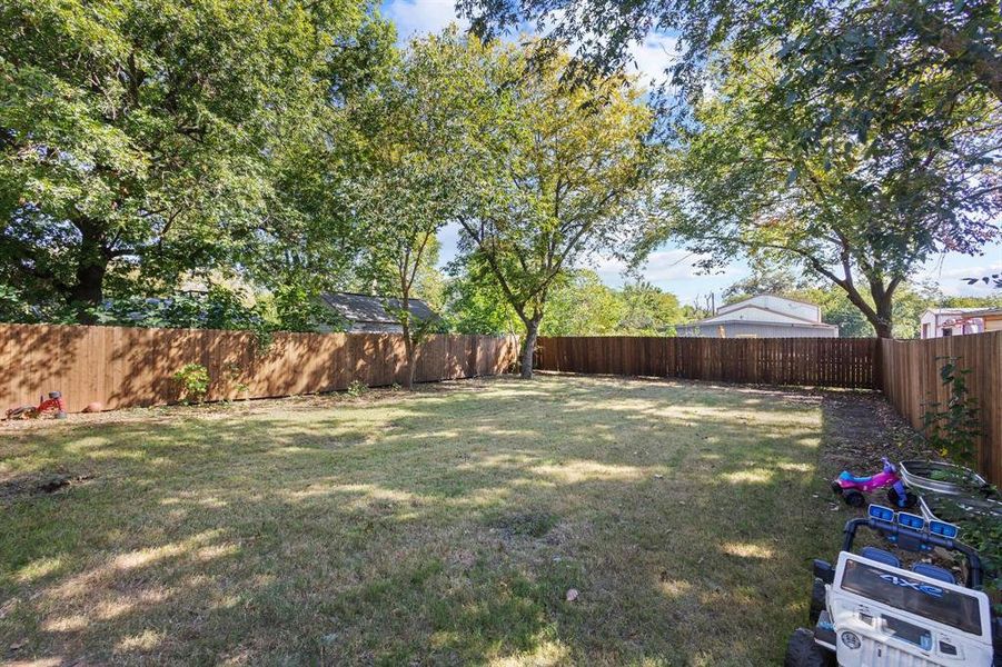 View of fenced backyard