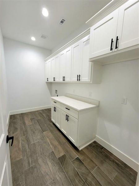 Laundry room featuring cabinets and washer hookup