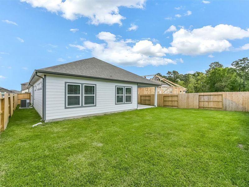 Exterior details and patio area of a home in Sundance Cove, Crosby (Image 30).