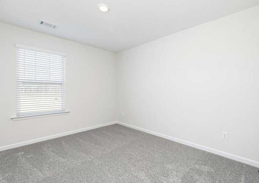 This third bedroom boasts tons of natural light