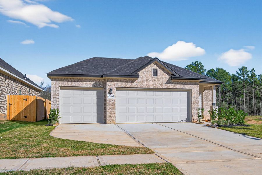 Front exterior of a new home in Enclave at Willis, Willis, TX, highlighting curb appeal (Image 19).