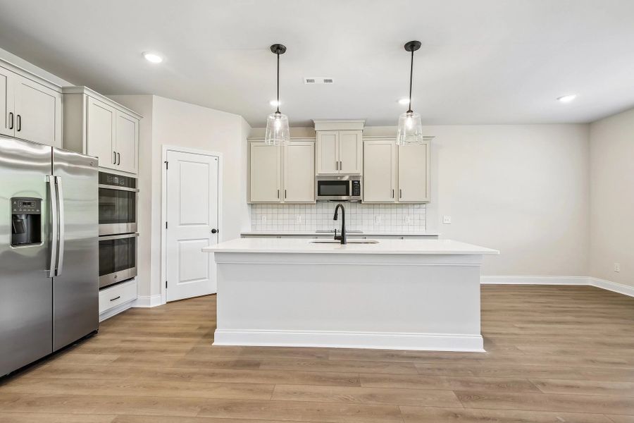 Gourmet Kitchen with double ovens featuring AW Collection® Artisan