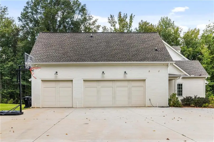 Front exterior of a new home in , Chattahoochee Hills, GA, highlighting curb appeal (Image 1).