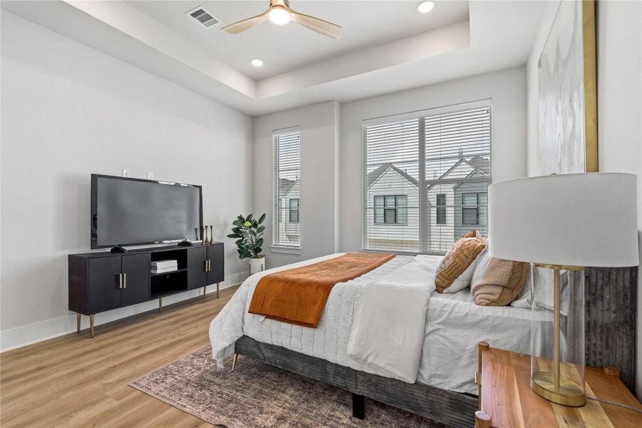 Framed by oversized windows, the bedroom is naturally bright throughout the day while maintaining a private setting. Framed by oversized windows, the bedroom is naturally bright throughout the day while maintaining a private setting.