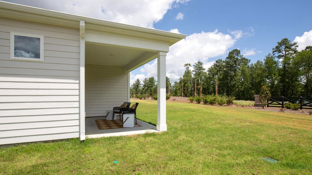 Representative exterior photo of a completed home built from the TUSCAN II by D.R. Horton in Indigo Preserve Townhomes, Leland, NC (Image 21).