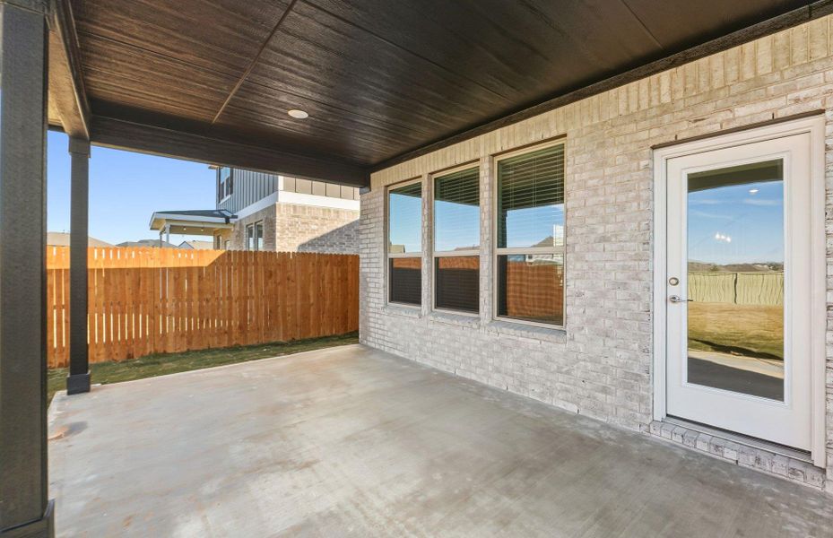 Exterior details and patio area of a home in Santa Rita Ranch, Liberty Hill (Image 14).