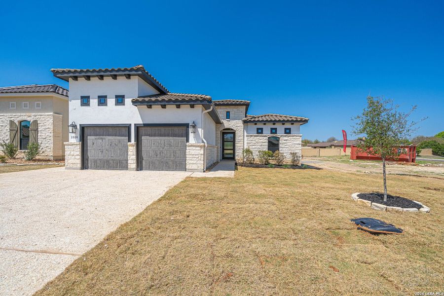 Front exterior of a new home in , Kerrville, TX, highlighting curb appeal (Image 16).