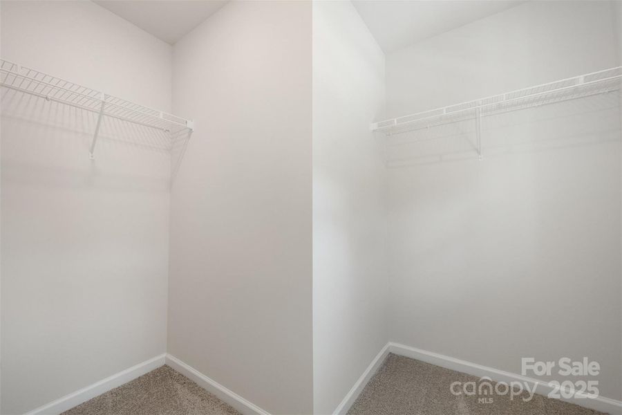 Primary suite Walk-in-Closet #1. Representational Photo.