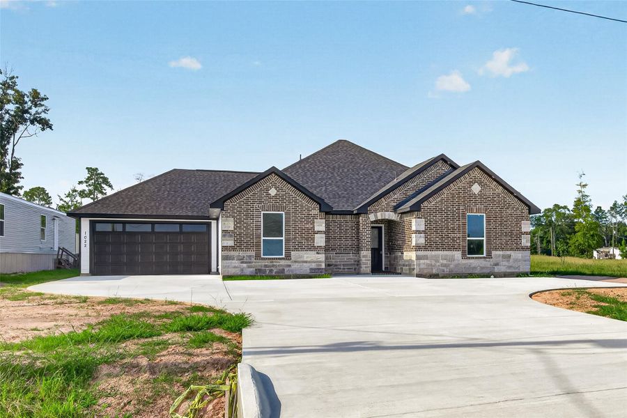 Custom-built home featuring thoughtful exterior details and a distinctive presence within the community.