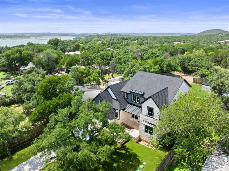 Drone / aerial view of a nearby body of water and a forest Drone / aerial view of a nearby body of water and a forest