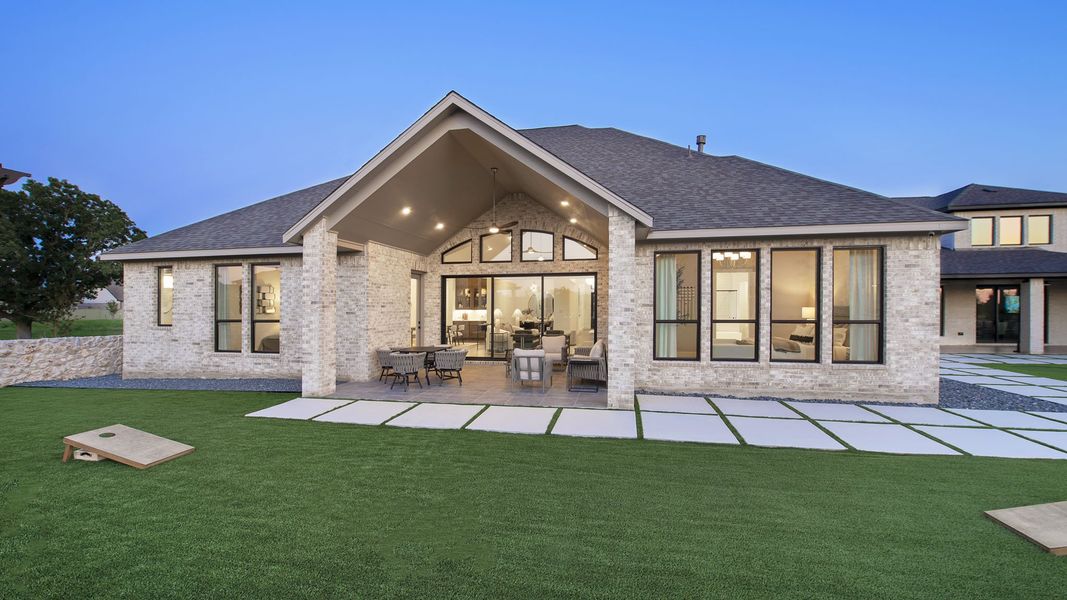 Representative exterior photo of a completed home built from the 3566W by Perry Homes in Sonoma Verde 70', Rockwall, TX (Image 16).