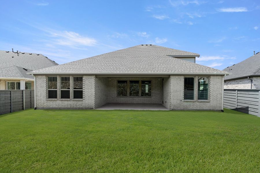Front exterior of a new home in Inspiration Collection at Union Park, Little Elm, TX, highlighting curb appeal (Image 14).