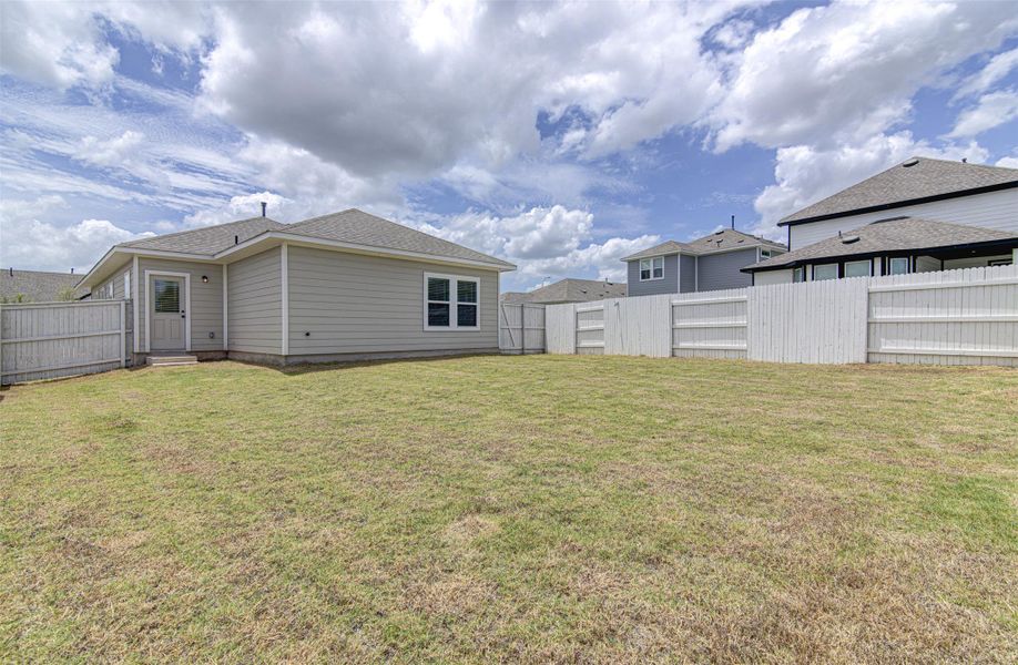 A generous backyard, fully fenced for privacy, offers ample space for outdoor enjoyment. A generous backyard, fully fenced for privacy, offers ample space for outdoor enjoyment.