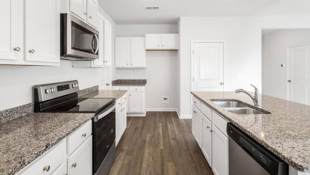 Furnished interior view inside a new home in The Pines at Blake Farm, Wilmington (Image 7).